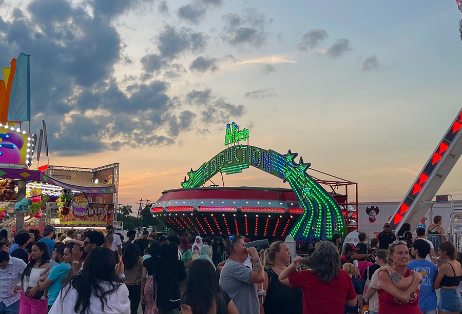 Crowded midway at twilight